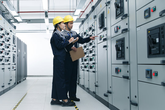 Technicians work in a factory