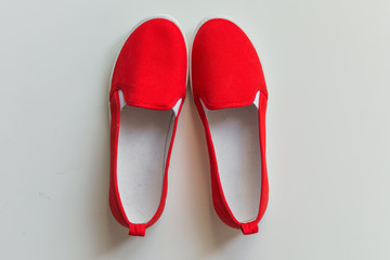 Red style woman sneakers. Fashion female footwear.