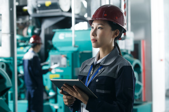 Technicians work in a factory