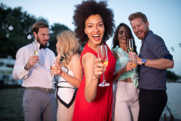 Group of friends having fun and celebrating group gathering