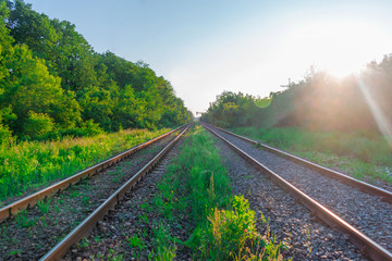Fototapeta na wymiar Railroad tracks stretching into the distance