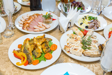 Dishes on a served banquet table  in restaurant