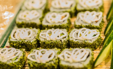 delicious green roll sushi display on the tray background