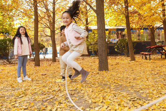 Boys and girls play outdoors
