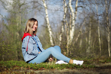 Girl sitting in the forest