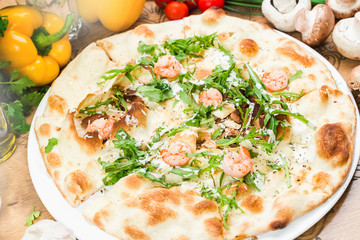 Traditional Italian pizza, vegetables, ingredients. Pizza is cooking in the oven. Pizza menu