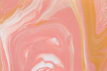 photography of abstract marbleized effect background. gold, yellow and white creative colors. Beautiful paint