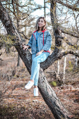 Girl sitting in the forest