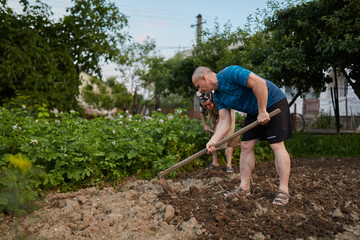 Old mother and son farmers