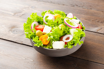 Vegetarian salad on wooden background