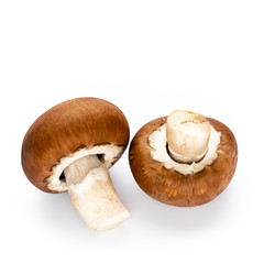 Fresh champignon mushrooms isolated on white.