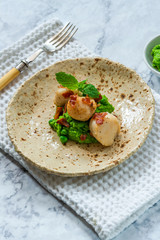 Scallops with minted peas and crispy pancetta