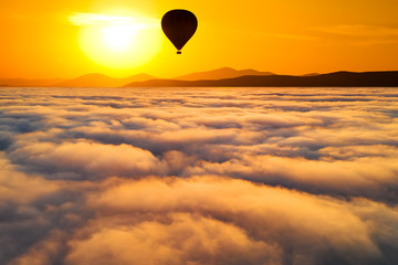 Fototapeta na wymiar Beautiful misty dawn. Flying above the clouds, drone video