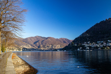 Lake Como embankment at sunrise, Italy.