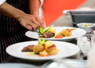 Chef preparing food in the kitchen, chef cooking, Chef decorating dish