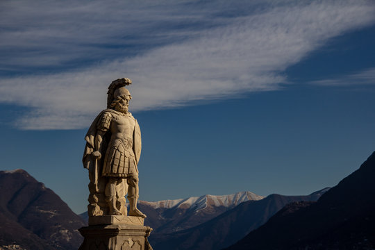 Statue of a warrior at Villa Olmo in Como. Mountain View. Northern Italy.
