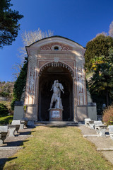 Fototapeta na wymiar Sculpture in an arch in the park of Villa D'Este, Cernobbio. Lake Como, Italy.