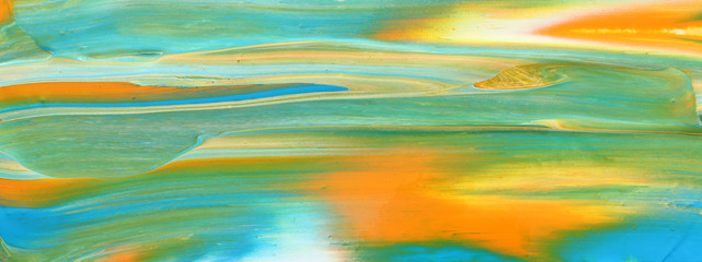 photography of abstract marbleized effect background. gold, yellow, blue and green creative colors. Beautiful paint. banner