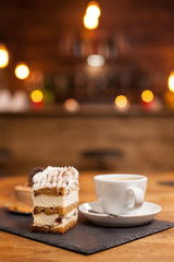 Delicious chocholate cake with white cream and cinnamon on top