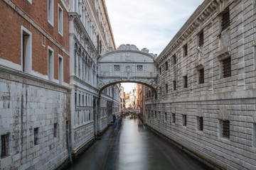 Fototapeta na wymiar View of the Bridge of Sighs (Ponte dei Sospiri) and the Rio de Palazzo or de Canonica Canal in Venice, Italy. The Ponte de la Canonica is visible in background
