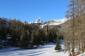 Italian Alps, Valle d'Aosta, Italy. Winter mountains view with the Matterhorn peak  on background.