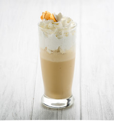 Coffee drinks with cream in glass on white background