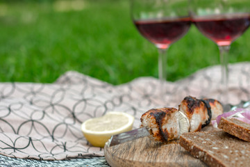 Delicious, juicy pork shish kebab. Concept picnic top view.