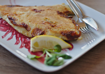 A fried flounder with lemon