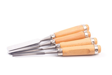 a set of chisels with wooden handle isolated .