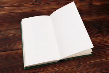 Old book wooden library desk, retro toned image, selective focus .