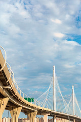 bottom view of the high-speed bridge over the Gulf of Finland on the blue sky background.