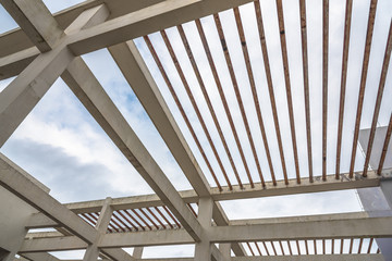 Obraz premium Urban modern high-rise building roof cement column beam and steel pipe staggered structure