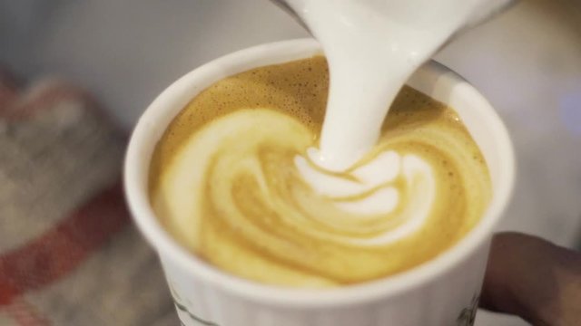 Slow motion close up shot making coffee