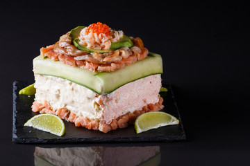 Piece of traditional savory swedish sandwich cake Smorgastorta