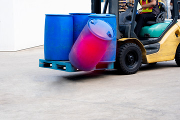 accident forklift with a pallet of barrels falling