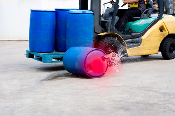 accident forklift with a pallet of barrels falling