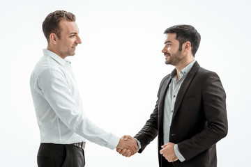 Businessmen making handshake on white background