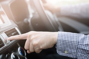  Men use the finger to press the emergency button on the car console to turn on the emergency light to warn the car accident on the road.