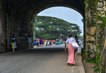 An old woman walking at ancient township