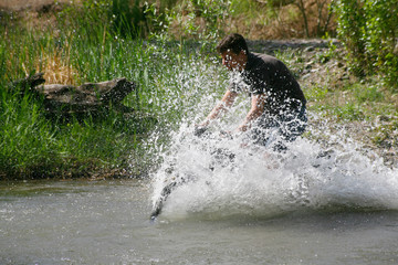 Cyclist at high speed overcomes the ford