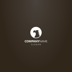 Obraz premium white logo on a black background. vector negative space round logo of bird of prey profile 