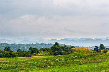 Beautiful landscape with meadow and hills in Slovenia