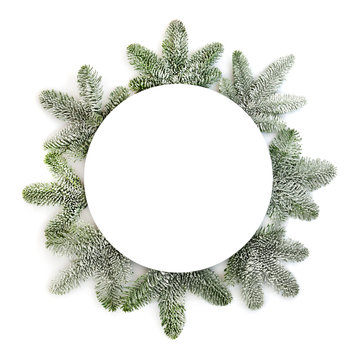 Christmas Table Setting With Round Plate And Snow Covered Spruce Fir On White Background With Copy Space.