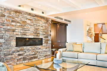 Colorful wall with furniture and stairs.