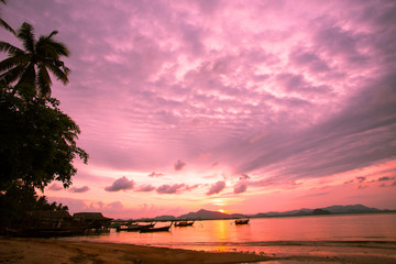 Silhouette of beautiful sunset with fishing boat