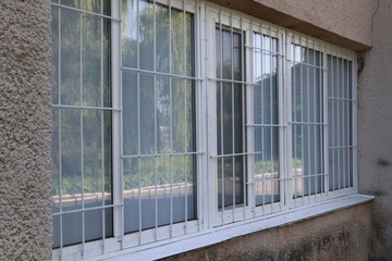 Metal grid for window protection.
