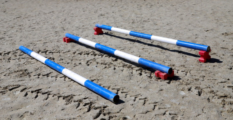 Outdoors photo of wooden barriers for jumping horses. Preparation of horses for performance on...