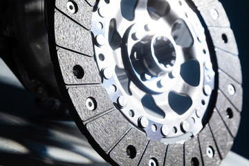 Close-up shot of clutch disk and basket on dark background