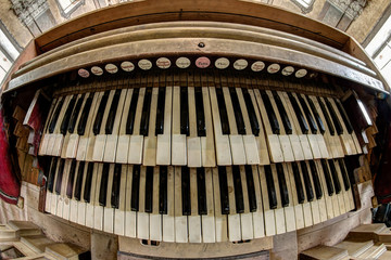 Fototapeta na wymiar Old and broken church organ - keyboard