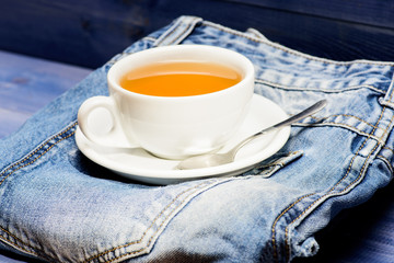 Process tea brewing in ceramic mug. Healthy habits. Tea time concept. Cup mug hot water and bag of...
